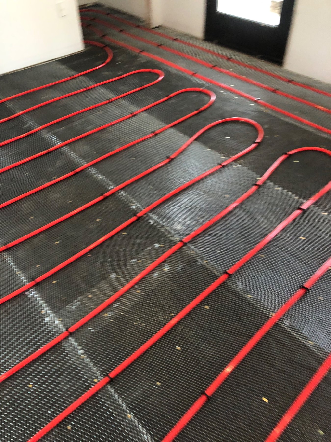 Radiant floor heating installation